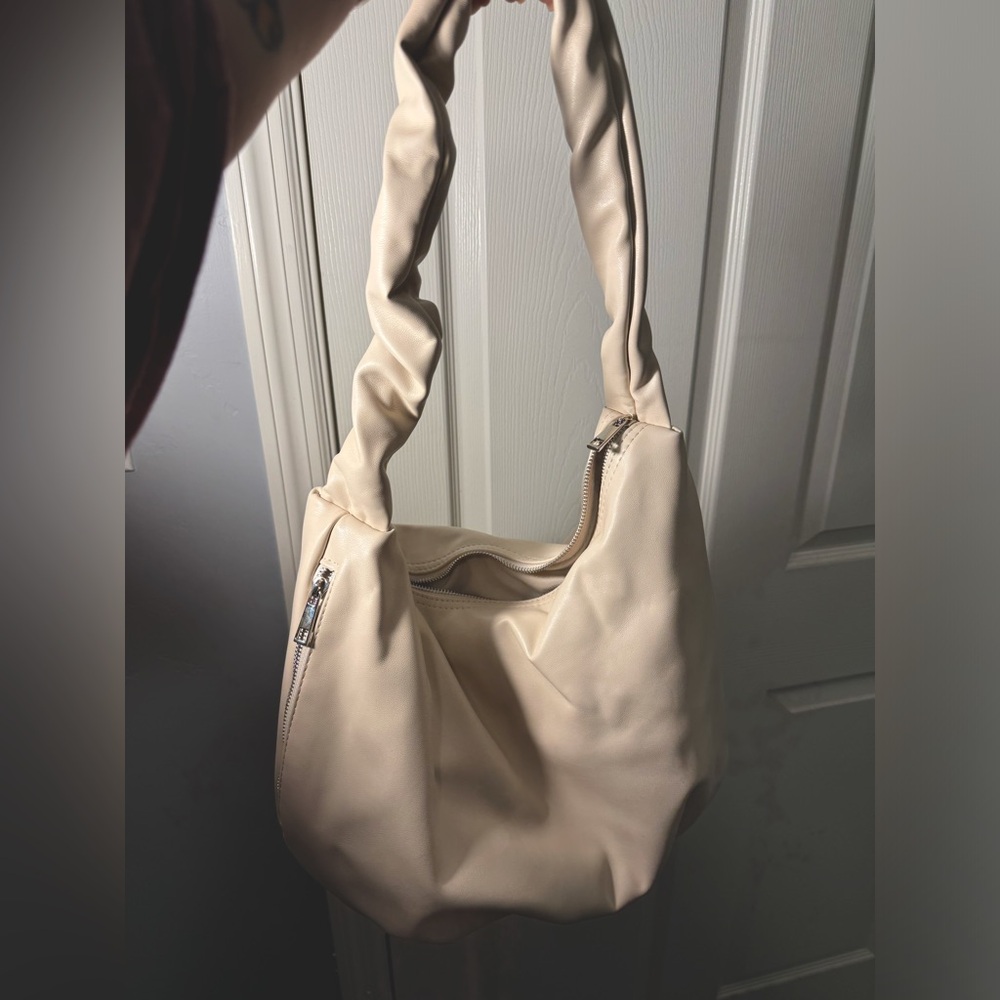 Cream puffy purse